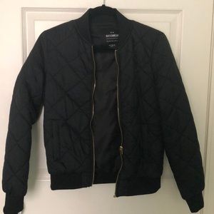 Black puffer jacket by outerwear